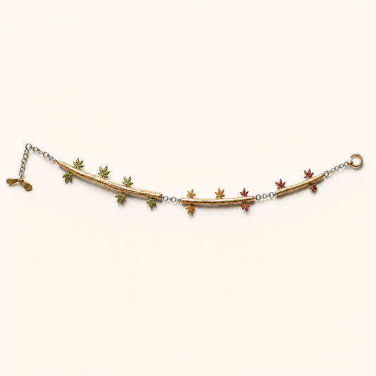 Autumn bracelet — gold bar with multicoloured maple leaf charms